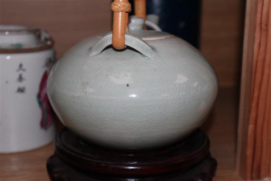 A Chinese famille rose teapot, a yellow glazed bottle vase, and a celadon glazed teapot vase 17cm incl. stand